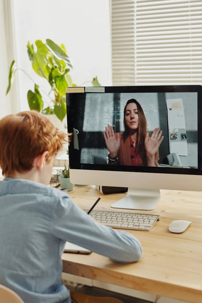 pexels-photo-4145196 Photo of Boy Video Calling With a Woman Through Imac
